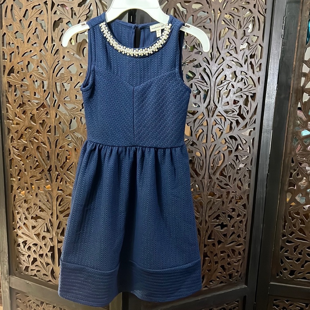 Brand new never worn navy blue dress with jeweled neckline. Girl's size 7